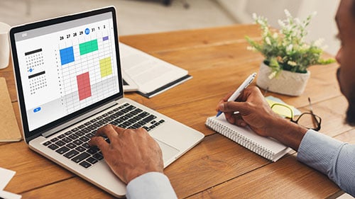 Man working on computer spreadsheet